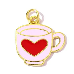High-quality macro view of a pink enamel coffee cup charm with a red heart for DIY jewelry