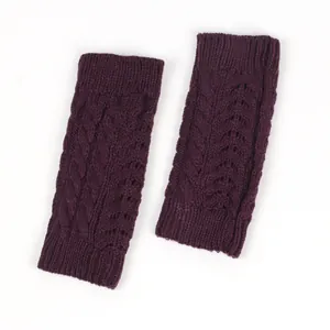 Detailed macro view of plum purple cable knit fingerless gloves for winter outdoor warmth