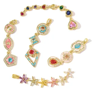 Detailed view of 18k gold plated jewelry pendants with colorful zircon and enamel art