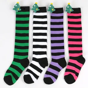 Detailed view of four pairs of kids' striped over-the-knee socks with plush trees.
