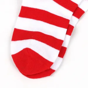 Macro detail of red and white striped knit texture on a Christmas sock toe