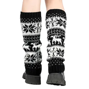 Rear view of knit leg warmers featuring black and white snowflake and reindeer patterns