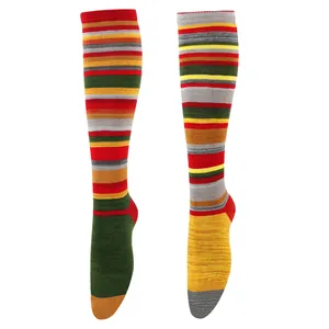 Macro view of retro Harajuku style knee-high socks with vibrant multi-color stripes