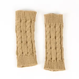 Detail view of khaki cable-knit fingerless arm warmers with a thick braided texture.