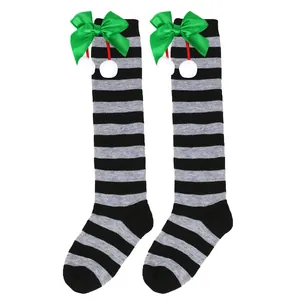 Christmas knee-high striped socks for girls with green bow and white pom-poms
