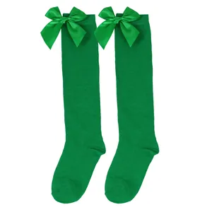 Vibrant green girls' knee-high socks with satin bows for Christmas and princess outfits