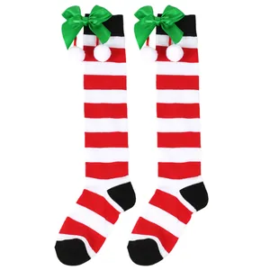 Kids' red and white striped Christmas high socks with green bows and white pom-poms