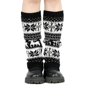 Detailed view of knitted leg warmers with Christmas snowflake and reindeer patterns