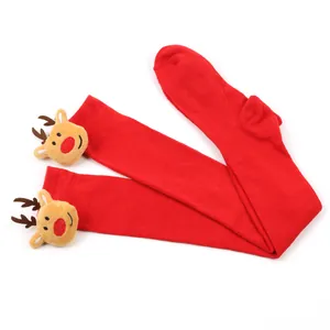 Detail view of festive red over-the-knee socks with plush reindeer head accents