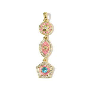 Macro view of long pendant with pink enamel charms and sparkling cubic zirconia stones