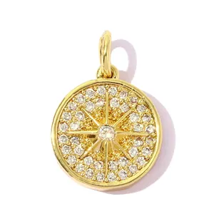 Detailed macro view of a gold-plated medallion pendant with pavé-set clear zircons
