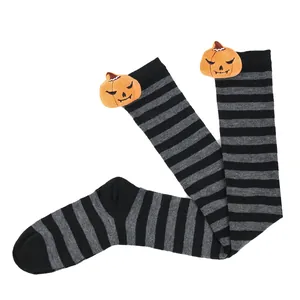 Halloween black and grey striped over-the-knee socks with pumpkin plush doll detail