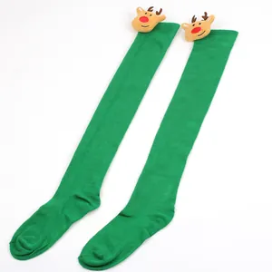 Festive green over-the-knee socks with cute plush reindeer heads for Christmas parties