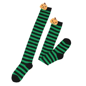 Green and black striped Halloween over-the-knee socks with cute pumpkin plush decoration