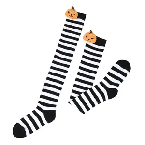 Detailed view of Halloween striped over-the-knee socks with cute pumpkin dolls