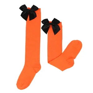High-quality children's Halloween orange knee-high socks with large black satin bows
