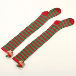 Festive red and green striped over-the-knee socks with cute reindeer plush accessories.