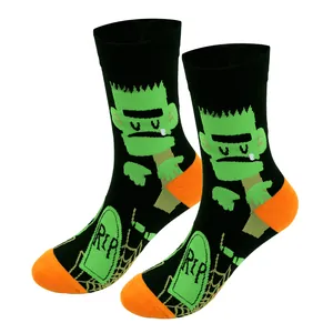 Close-up of Halloween men's crew socks with Frankenstein and RIP gravestone design