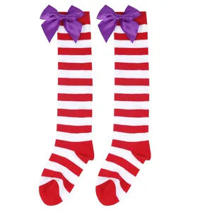 Red and white striped over-the-knee socks for girls featuring large purple satin bows.