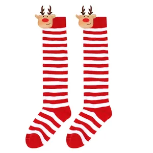 Close-up of festive red and white striped kids' Christmas socks with a 3D reindeer plush