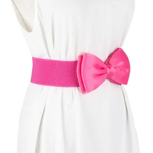 Detailed macro view of a bright pink elastic waist belt with a large satin bow decoration