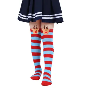 Close-up of children's Christmas over-the-knee socks with cute 3D elk plush doll detail.