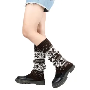 Knitted leg warmers with festive snowflake pattern for winter warmth and cozy style.