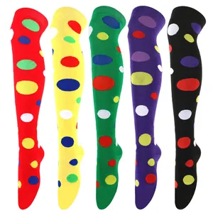 Macro view of colorful polka dot over-the-knee socks in five vibrant base colors.