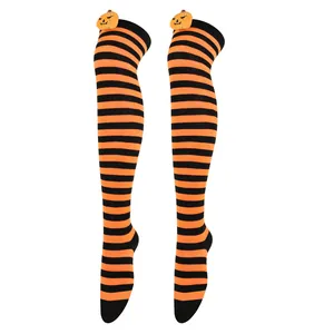 Halloween orange and black striped over-the-knee socks with cute 3D pumpkin plush detail