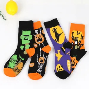 Detailed view of Halloween crew socks featuring vibrant pumpkin and witch designs