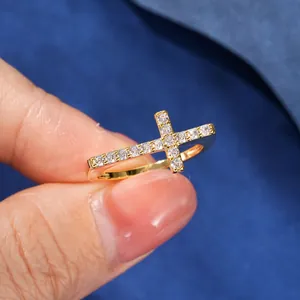 Detailed close-up of 14k gold filled cross ring set with sparkling round zircons