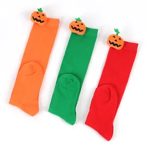 Soft Halloween knee-high socks for kids with cute pumpkin doll decorations