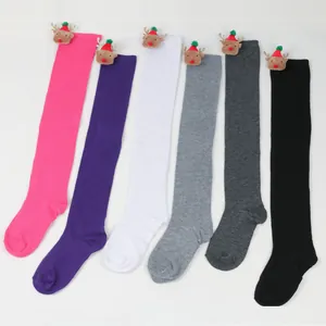 Set of colorful Christmas over-the-knee stockings with 3D reindeer plush ornaments.