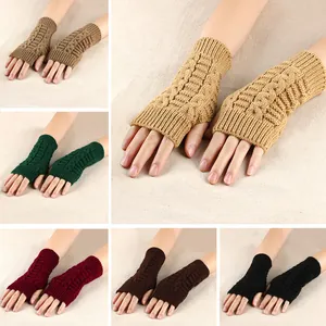 Macro view of cable knit fingerless arm warmers in various colors for autumn and winter