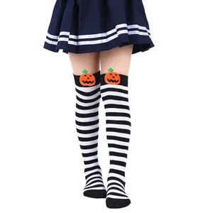 Detail of children's Halloween over-the-knee socks with cute pumpkin doll decor