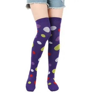Detailed view of vibrant purple multi-colored polka dot over-the-knee socks for cosplay