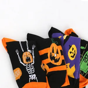 Detailed view of Halloween cotton socks with pumpkin and skeleton motifs.