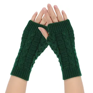 Dark green cable knit fingerless gloves providing winter outdoor warmth and comfort