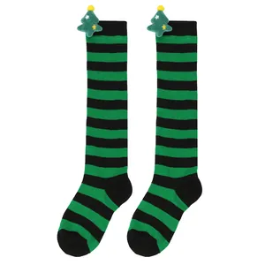 Striped children's Christmas over-the-knee socks featuring cute plush green tree dolls
