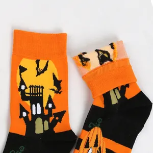 Detail view of Halloween men's cotton socks with haunted castle and bat knit pattern