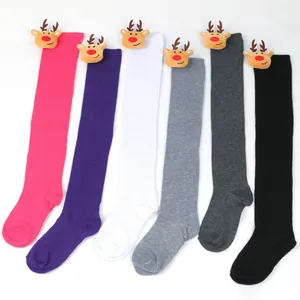Detailed view of various colorful Christmas over-the-knee socks featuring plush reindeer heads