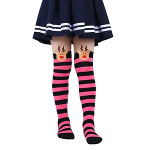 Close-up of children's pink striped Christmas over-the-knee socks with reindeer dolls