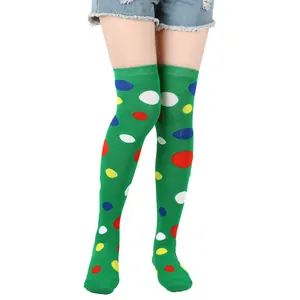 Detailed view of bright green over-the-knee socks with colorful polka dots for cosplay.