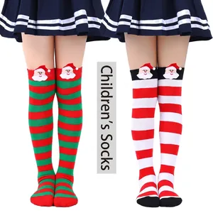 Detailed view of girls Christmas over-the-knee socks with 3D Santa Claus and stripes.