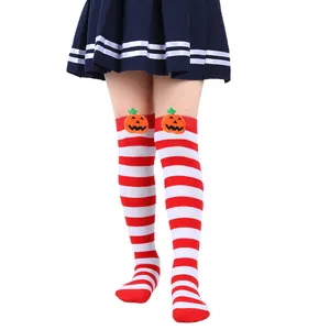 Detailed view of kids' Halloween over-the-knee socks with cute pumpkin dolls.