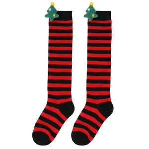 Kids' Christmas over-the-knee socks featuring red and black stripes and a plush tree detail