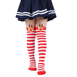 Detailed view of festive red and white striped over-the-knee socks with reindeer dolls