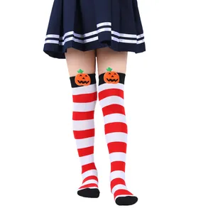 Detailed view of kids' Halloween striped over-the-knee socks with pumpkin dolls