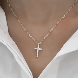 Close-up detail of a shimmering moissanite cross pendant necklace for elegant women
