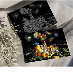 Detail view of colorful scratch art showing a vibrant castle with fireworks under night sky.
